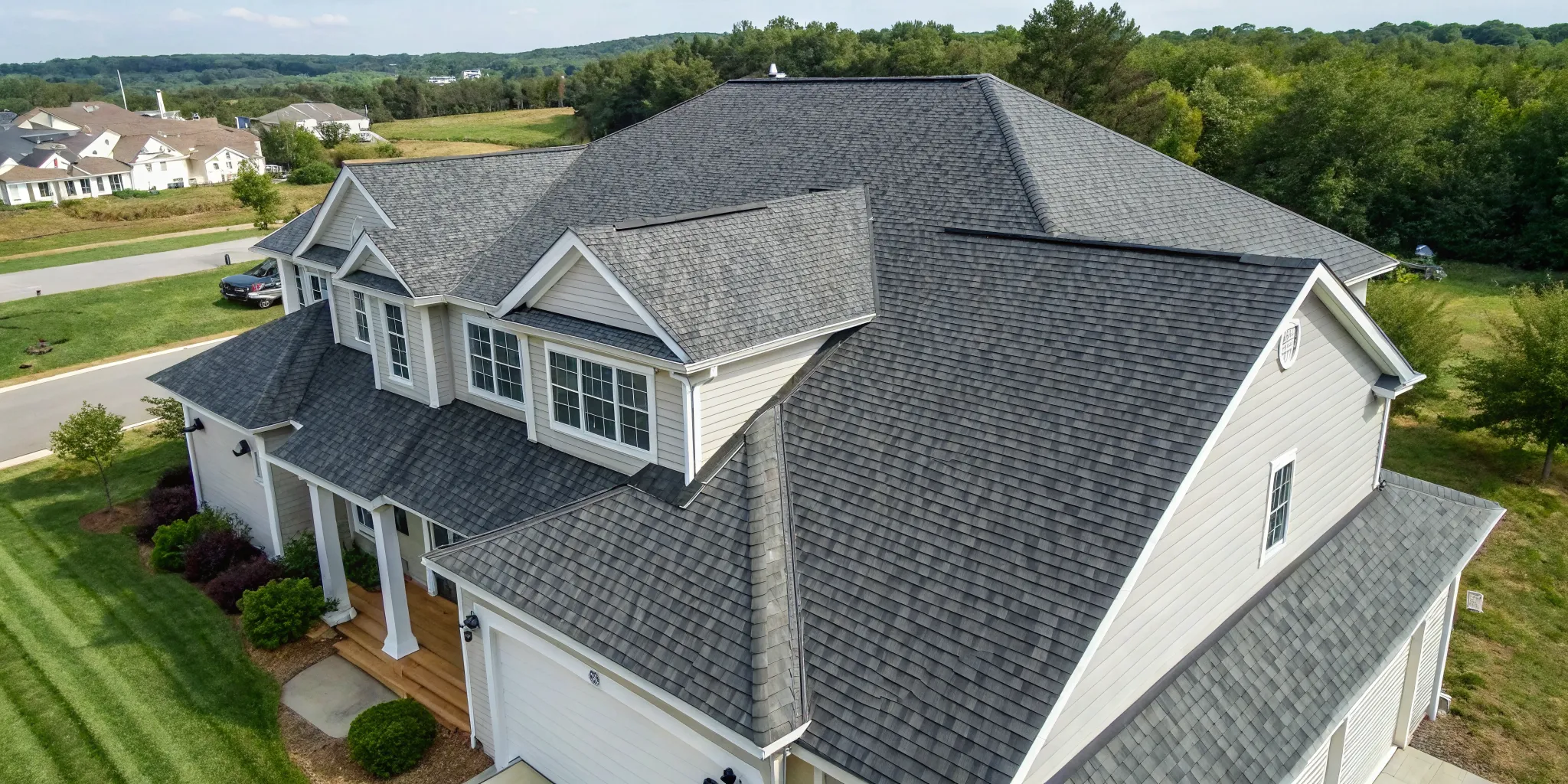 A completed asphalt shingle roof replacement on a residential home.